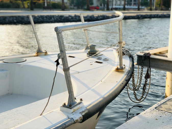 A boat tied to a dock Description automatically generated